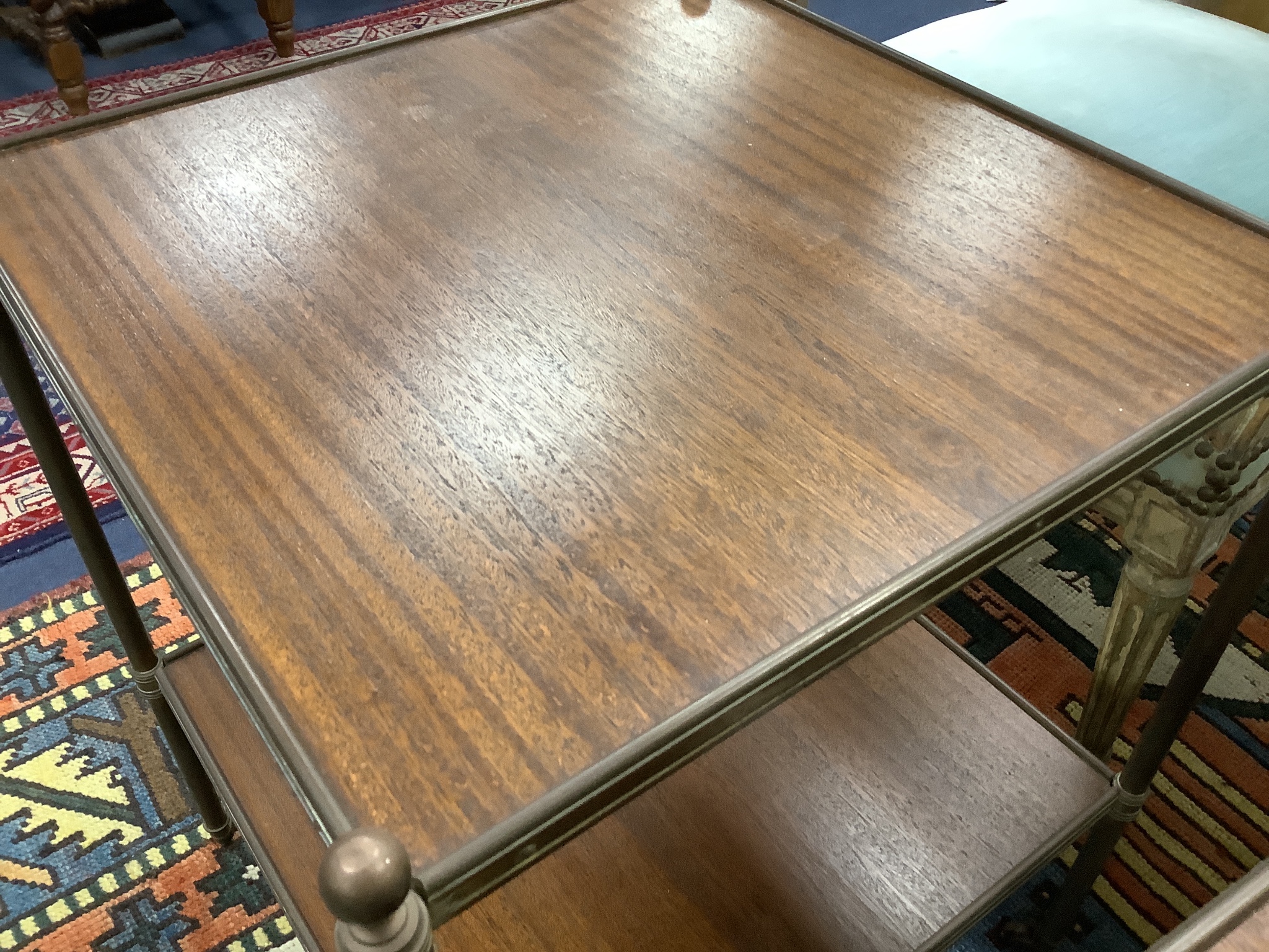 A pair of brass and teak two tier occasional tables, width 44cm depth 44cm height 58cm